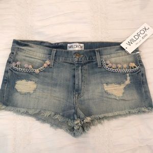 Wildfox destroyed denim shorts with detail